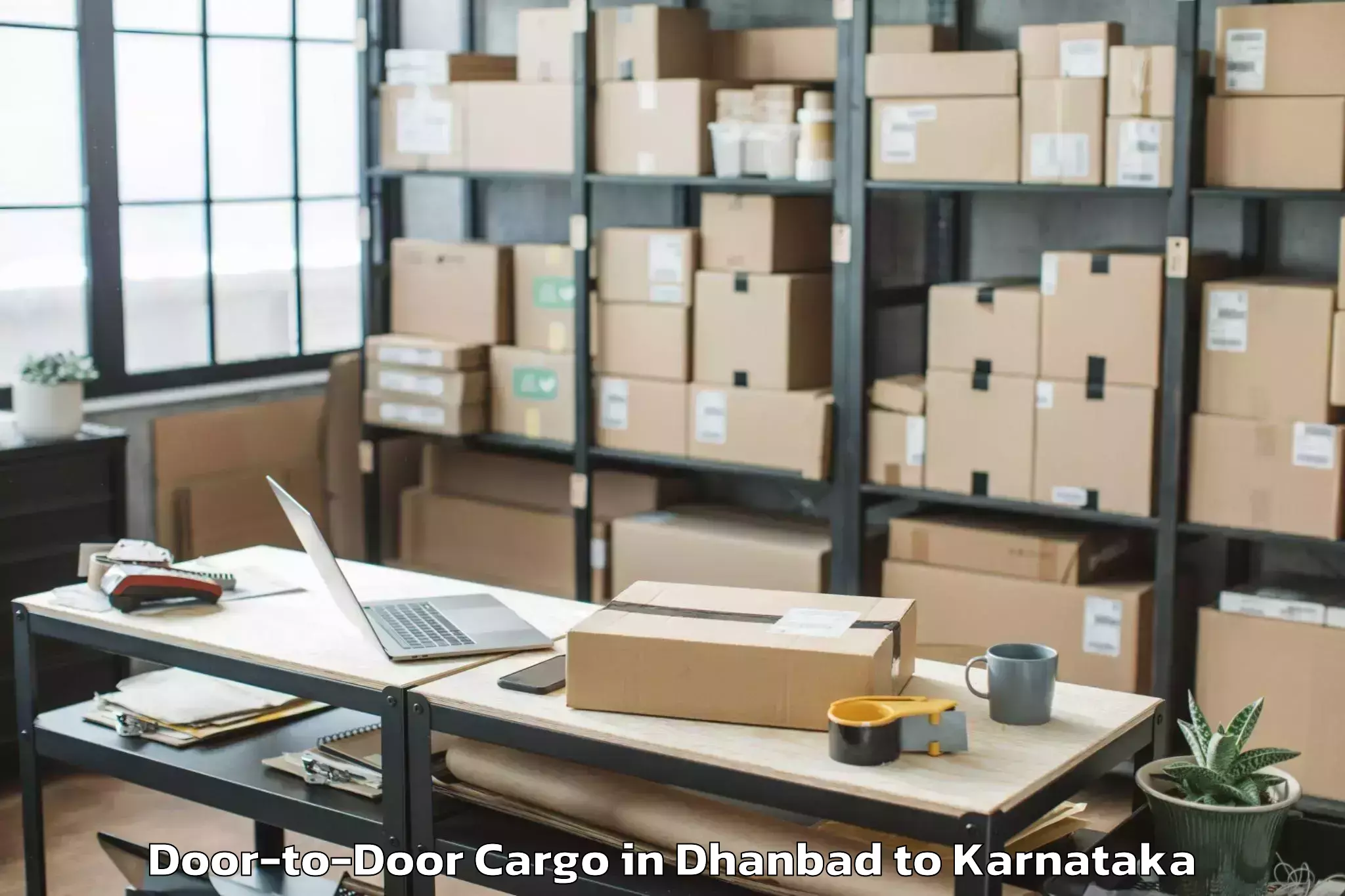 Dhanbad to Kannada University Vidyaranya Door To Door Cargo Booking